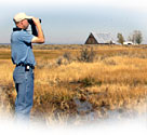 Todd Sloat scans for wildlife at the Ash Creek Wildlife Refuge.