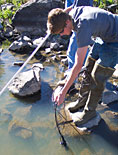 Kevin McAlerney taking dissolved oxygen measurements of the Pit River.