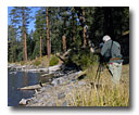 A hiker photographs Clear Lake.