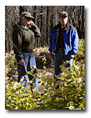 Sidney Smith, forest ecologist and Marty Yamagiwa, fishery biologist, stand amidst new aspen shoots in the Blue Fire area.
